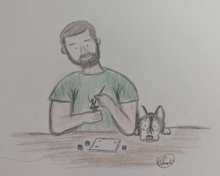 Pencil drawing of the developer painting a miniature at his desk, with his dog resting beside him